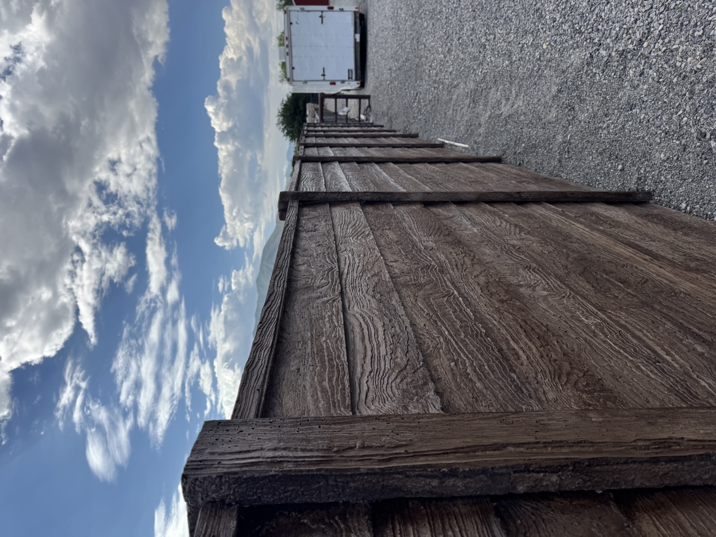 Concrete fencing running along a large property